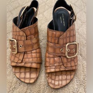 Elevate your style. Patent leather Perfect condition, crock print mules.